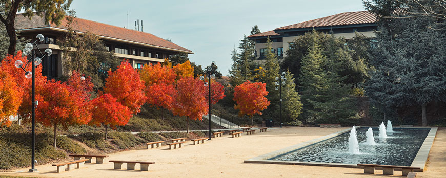 Campus fountains and buidlings with fall colored trees